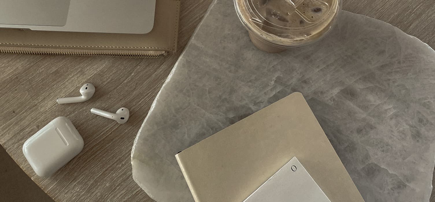 Laptop, notebook and crystals on a desk